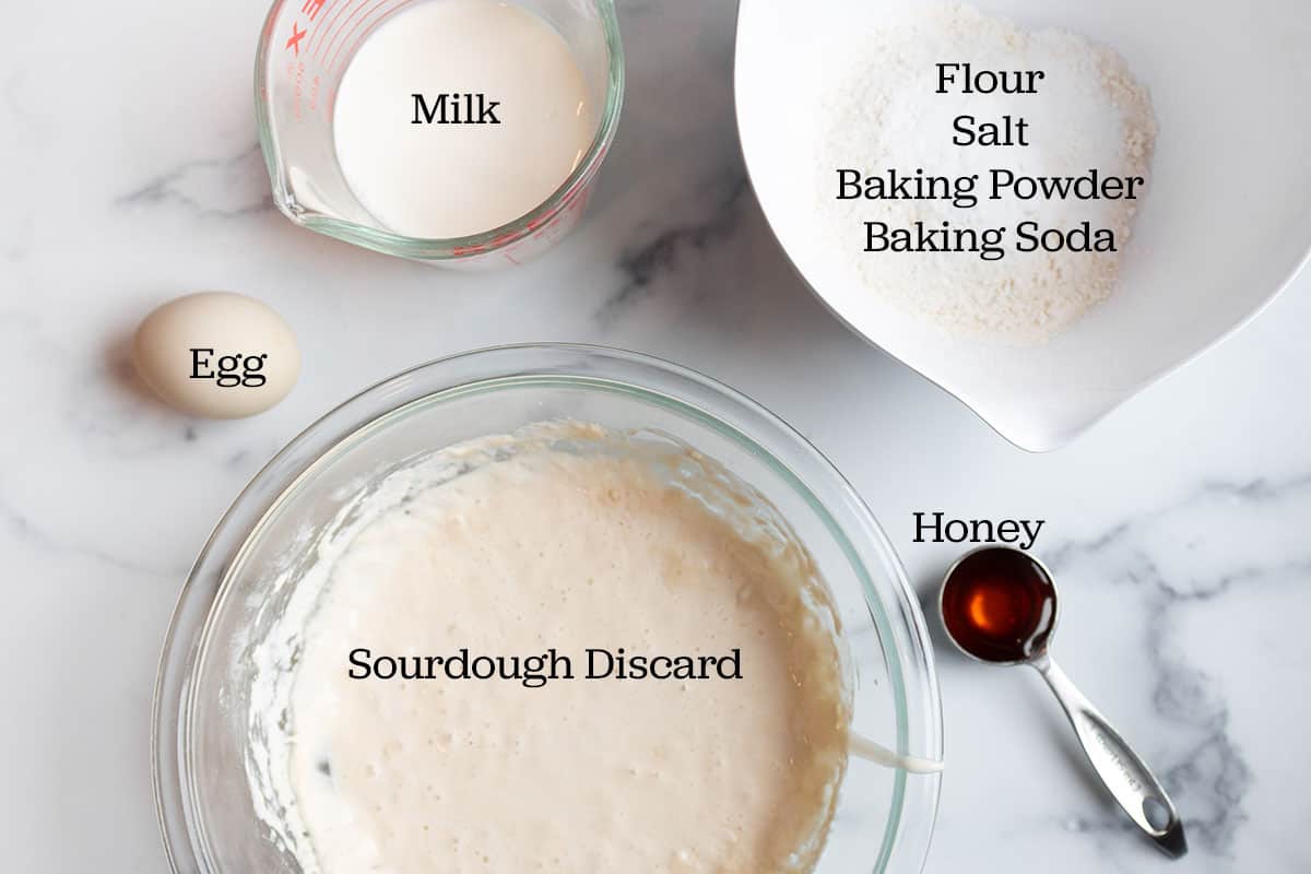 Sourdough starter discard, honey, salt, baking soda, flour, milk and an egg.