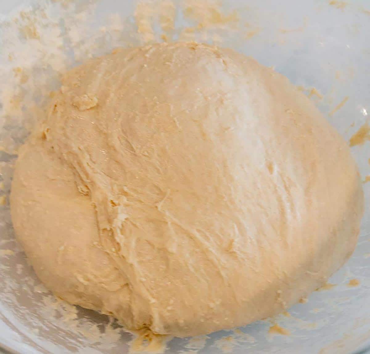 A ball of sourdough during the stretch and fold process.