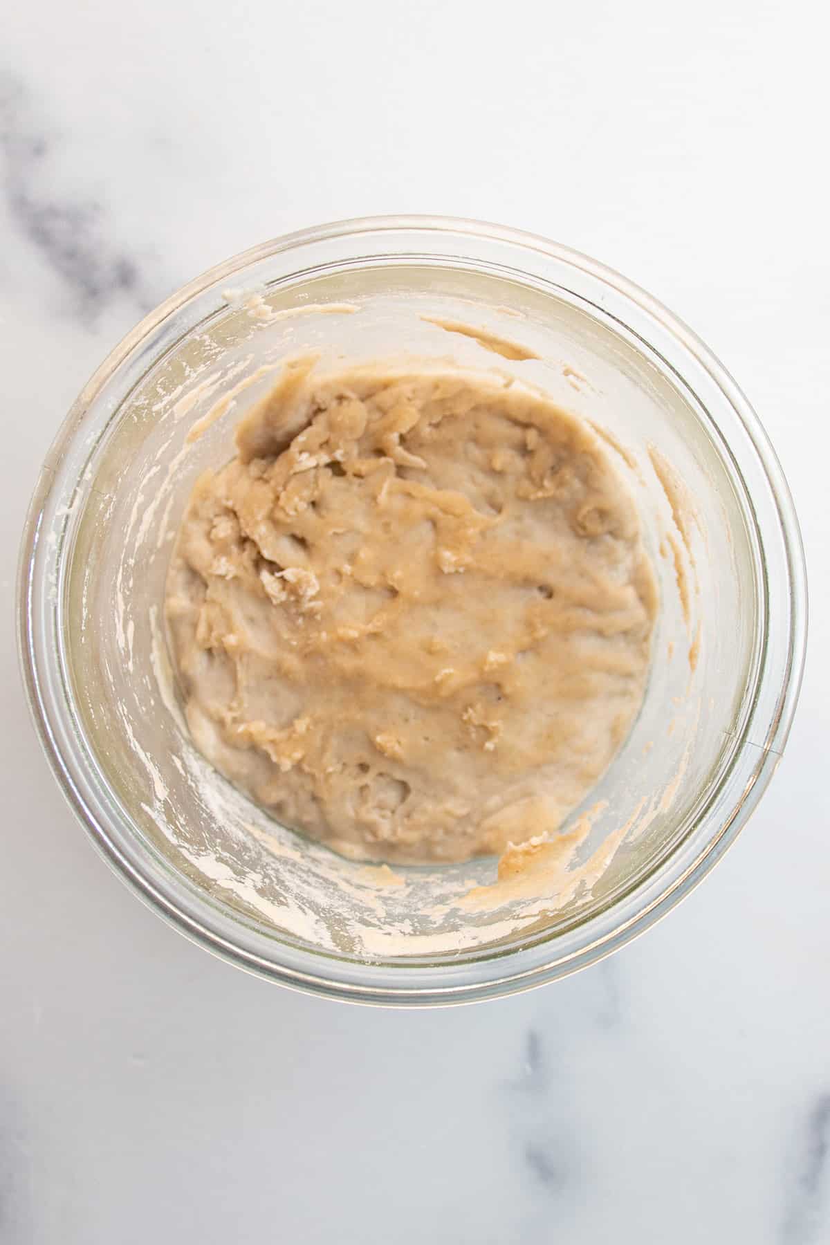 A jar with a sourdough starter on day 2.