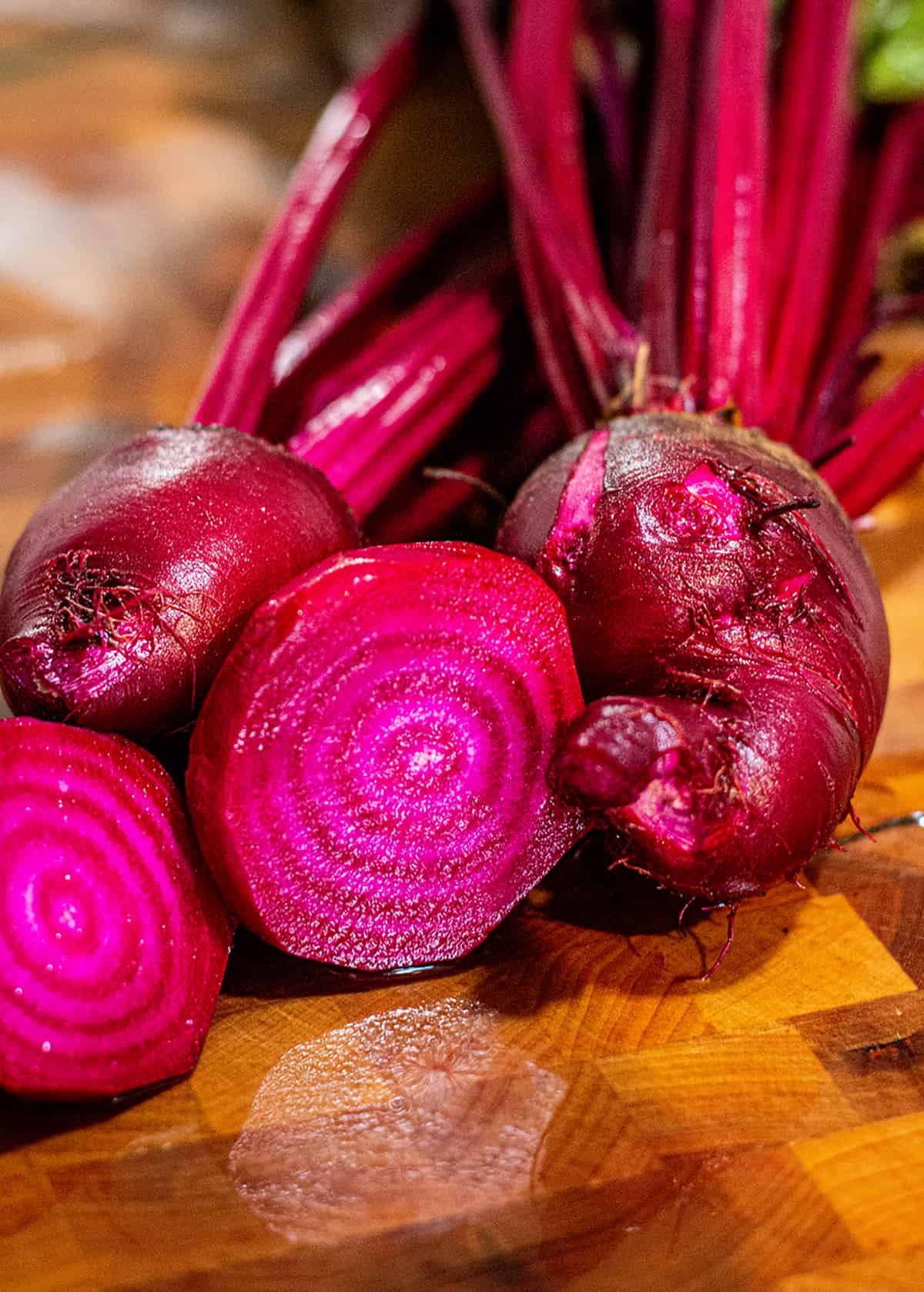 Fresh homegrown beets on a chopping block. 