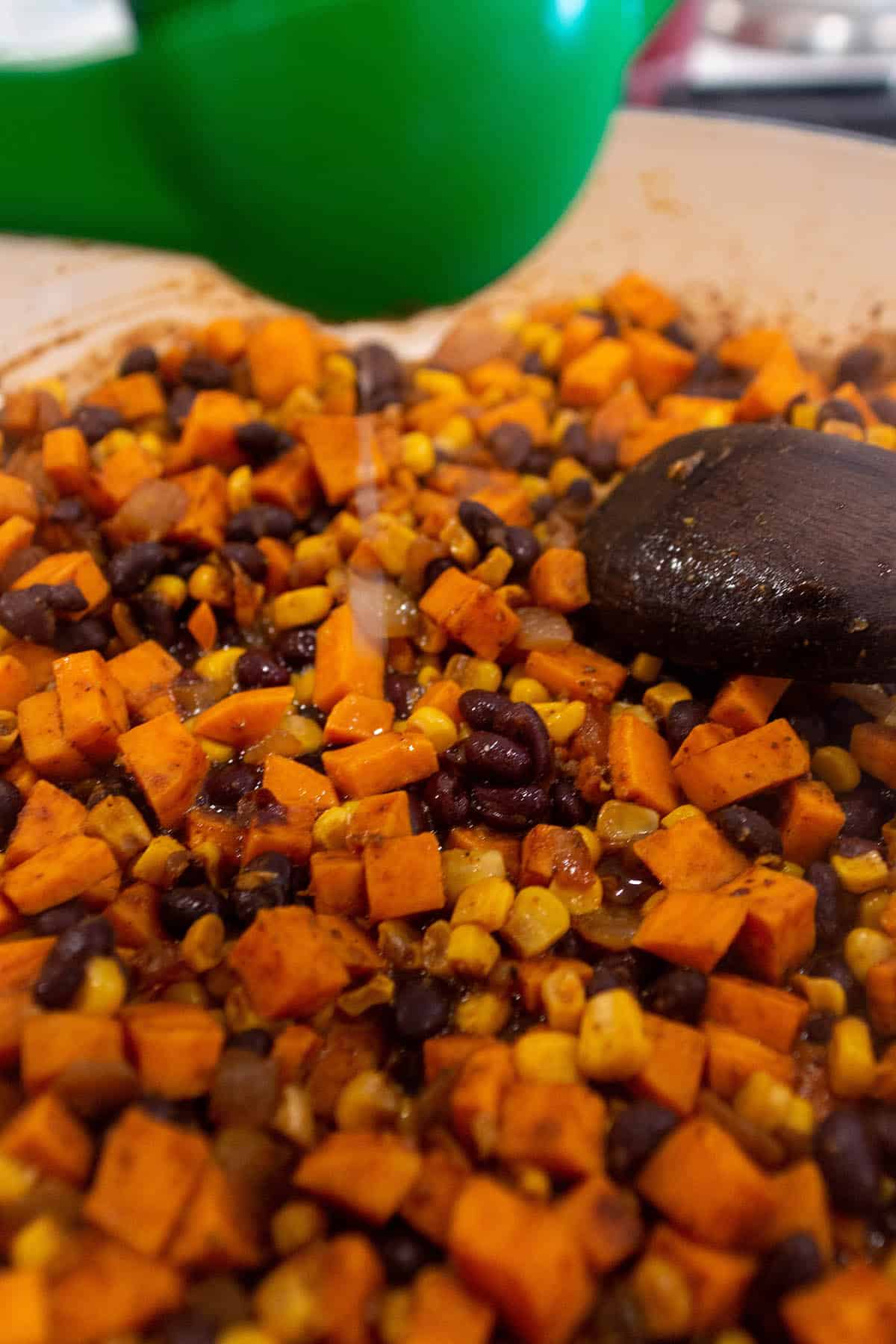 Citrus press squeezing lime juice in sweet potato tacos.