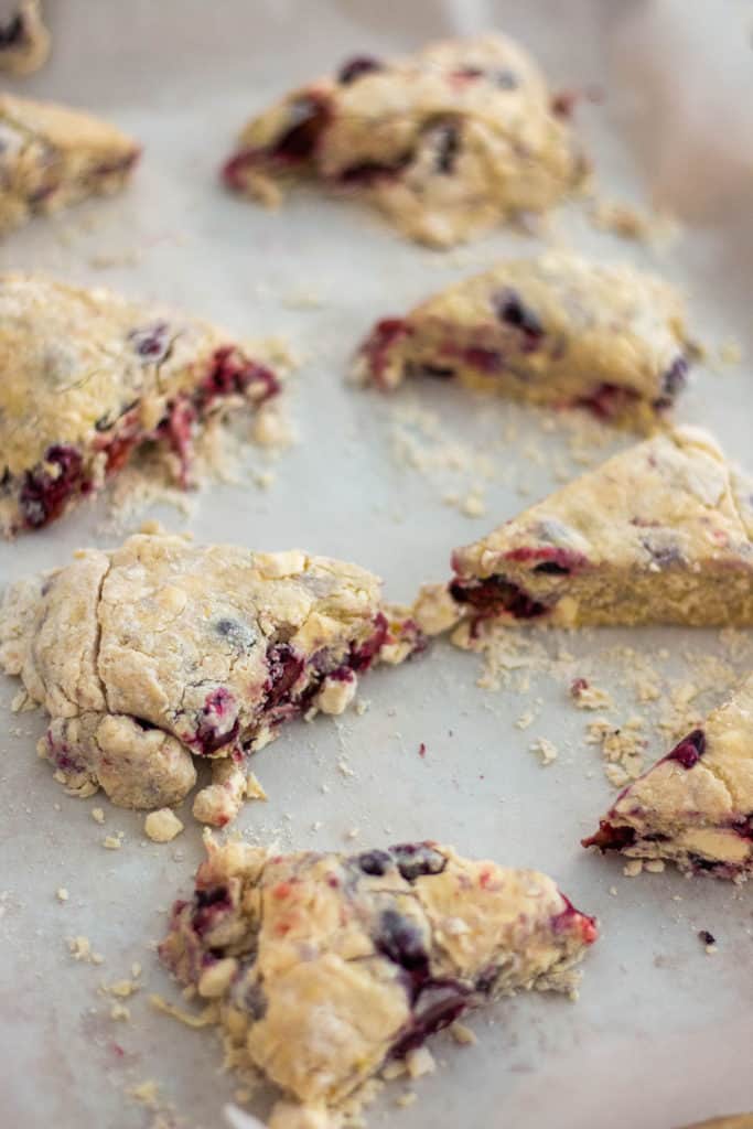 Homemade scones on parchment paper.