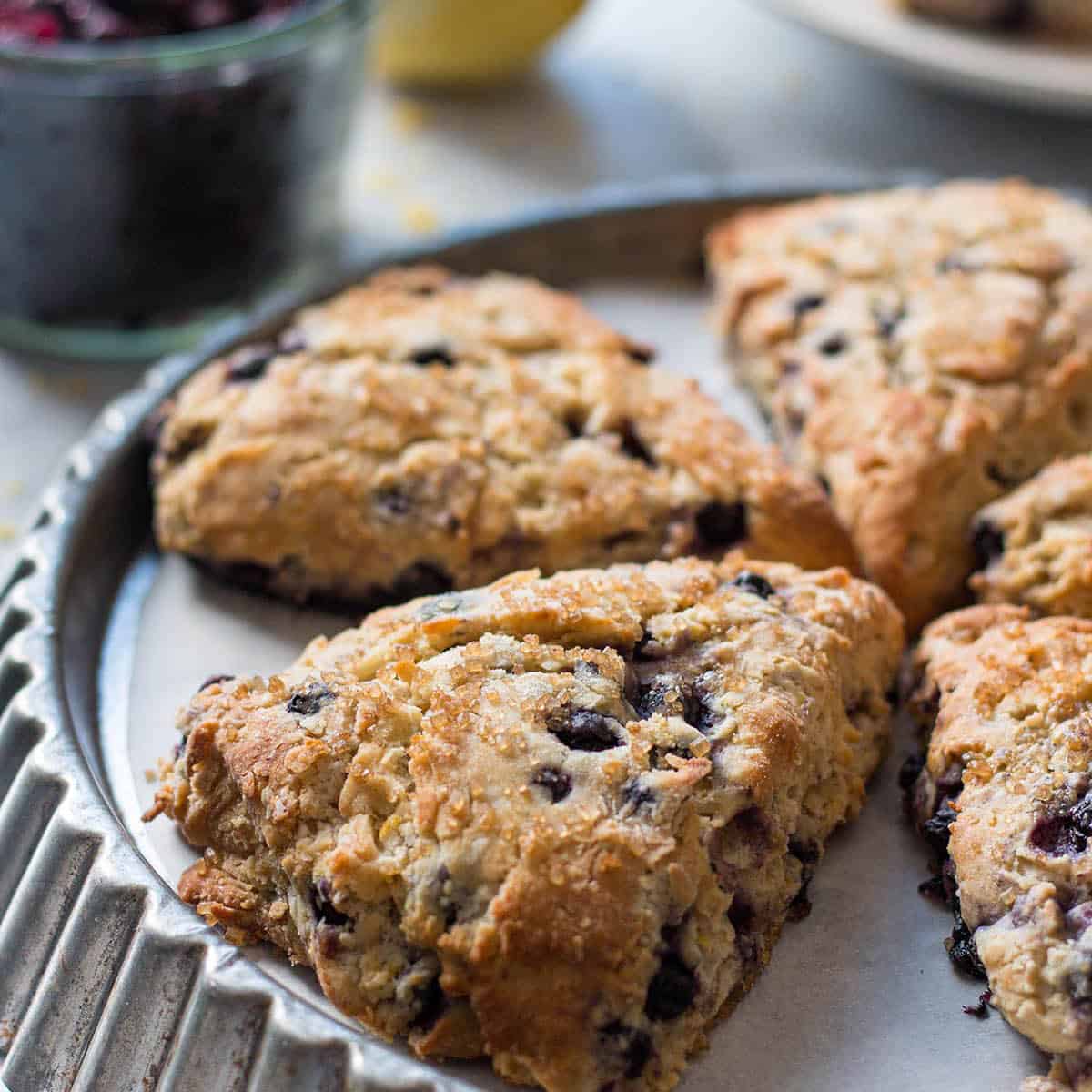 A vintage tart tin with blueberry scones.