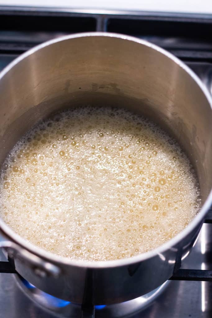 Oil and flour bubbling and browning in a sauce pan.
