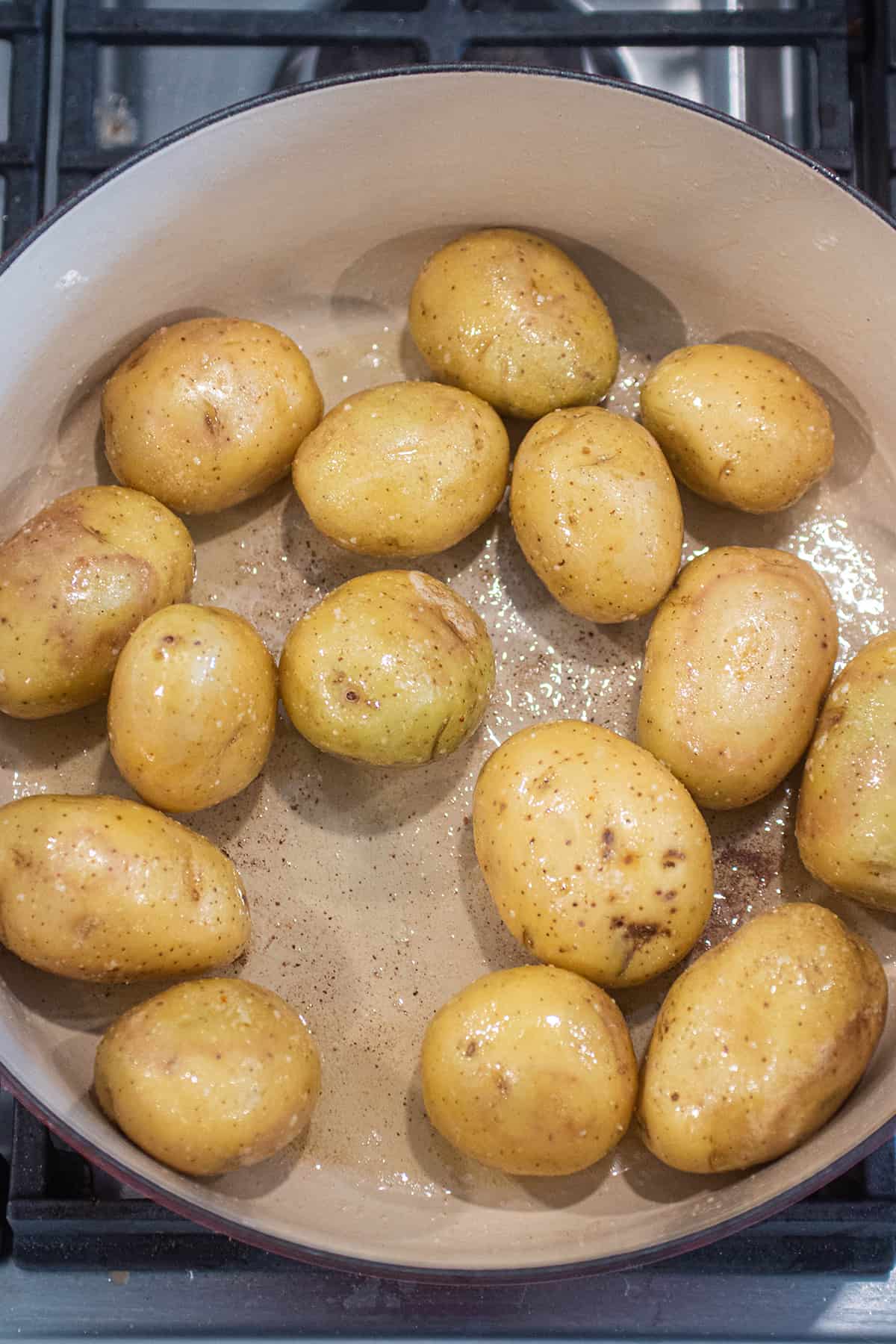 Yukon gold potatoes tossed in butter and salt in a dutch oven. 
