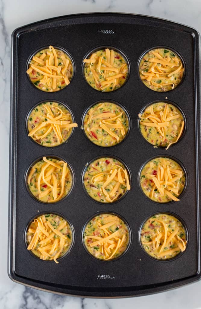 Sourdough breakfast bites divided in a 12 muffin pan