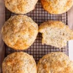 Lemon muffins with coarse sugar sitting on a cooling rack