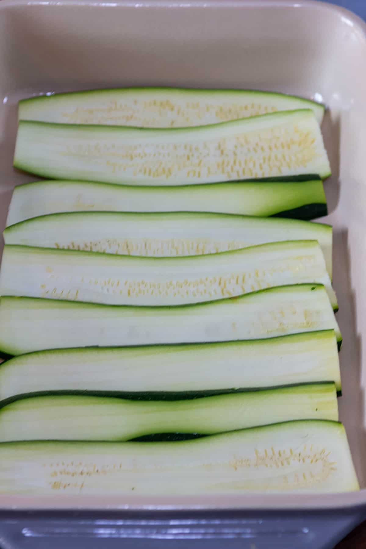 Zucchini noodles layered in a dish