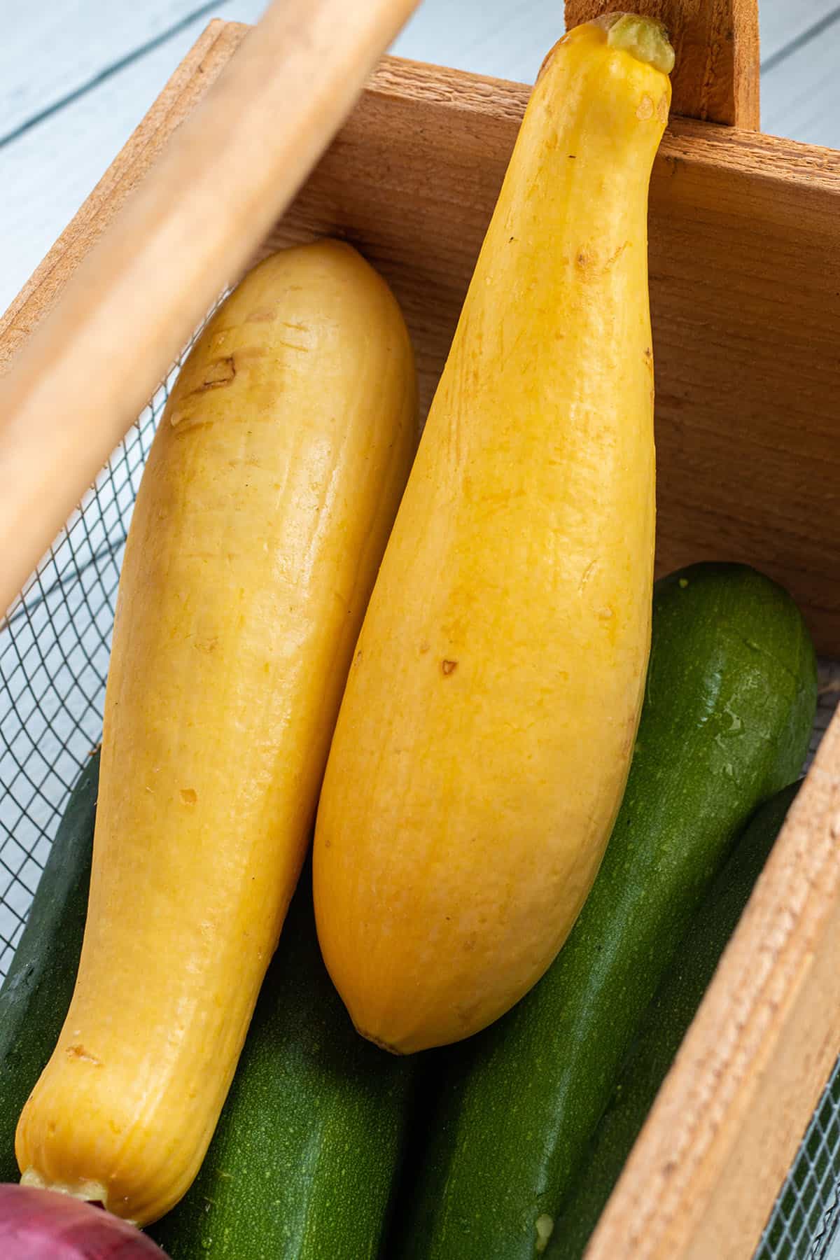 Gardening Basket with yellow summer squash. 