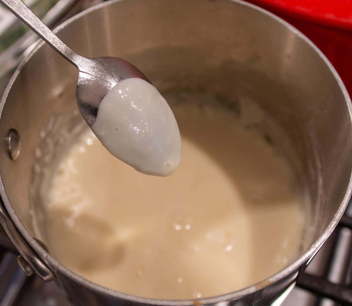 A spoon with a coating of homemade roux. 