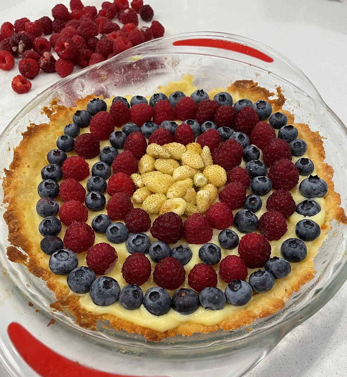 Tart dessert with fresh raspberries, blueberries and strawberries.