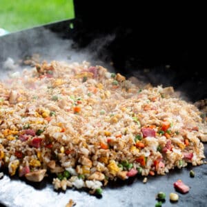 A Blackstone cook top with a pile of homemade fried rice.