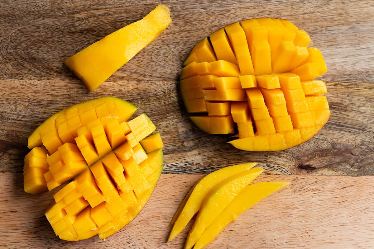 The 4 different pieces of a cut mango.