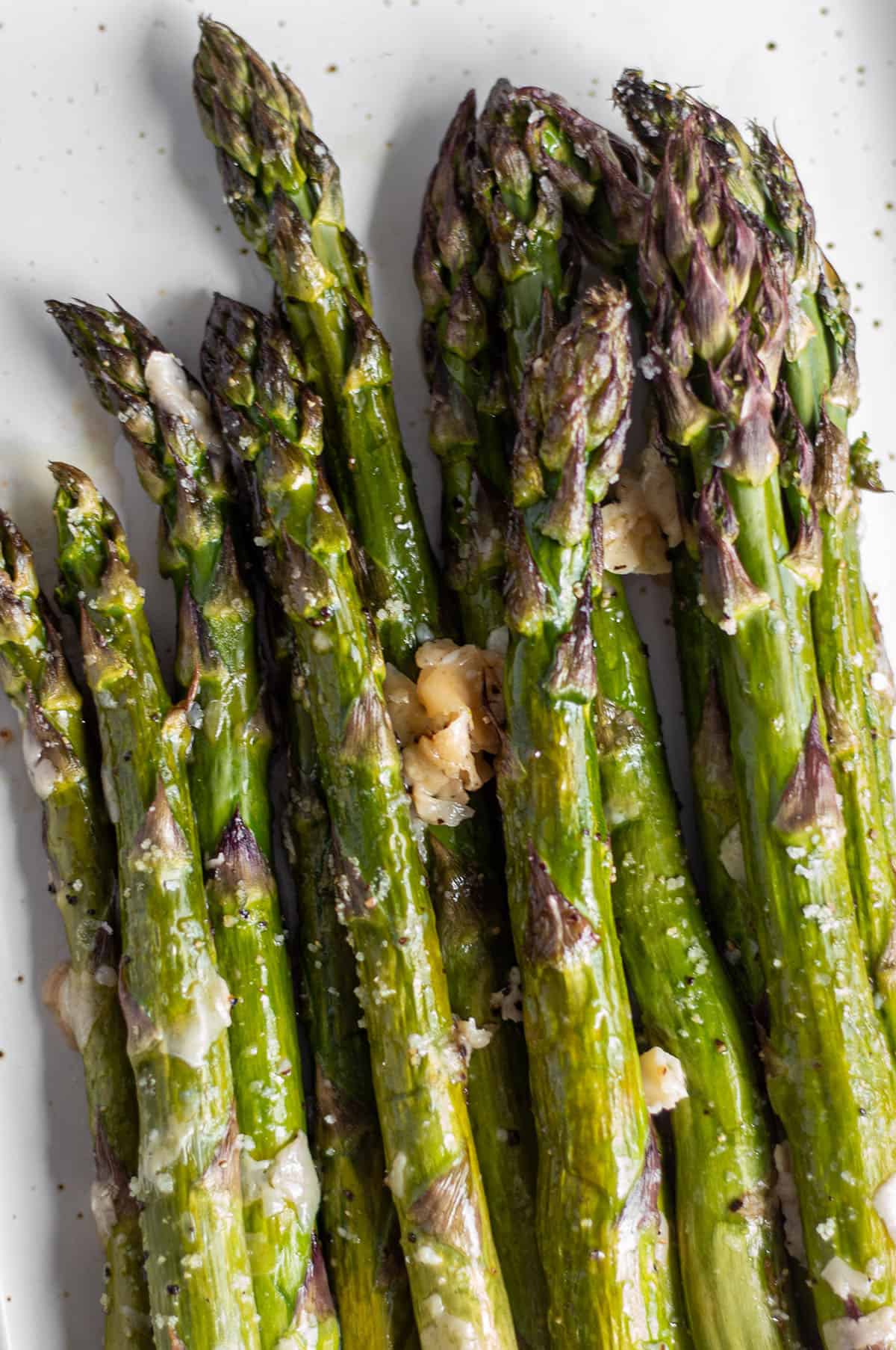 Oven-roasted asparagus with flakes of parmesan cheese. 