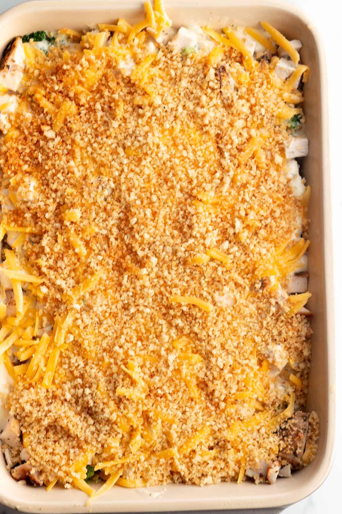 A casserole dish with a turkey divan topped with toasted panko crumbs.