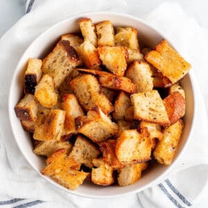 A bowl full of homemade croutons.