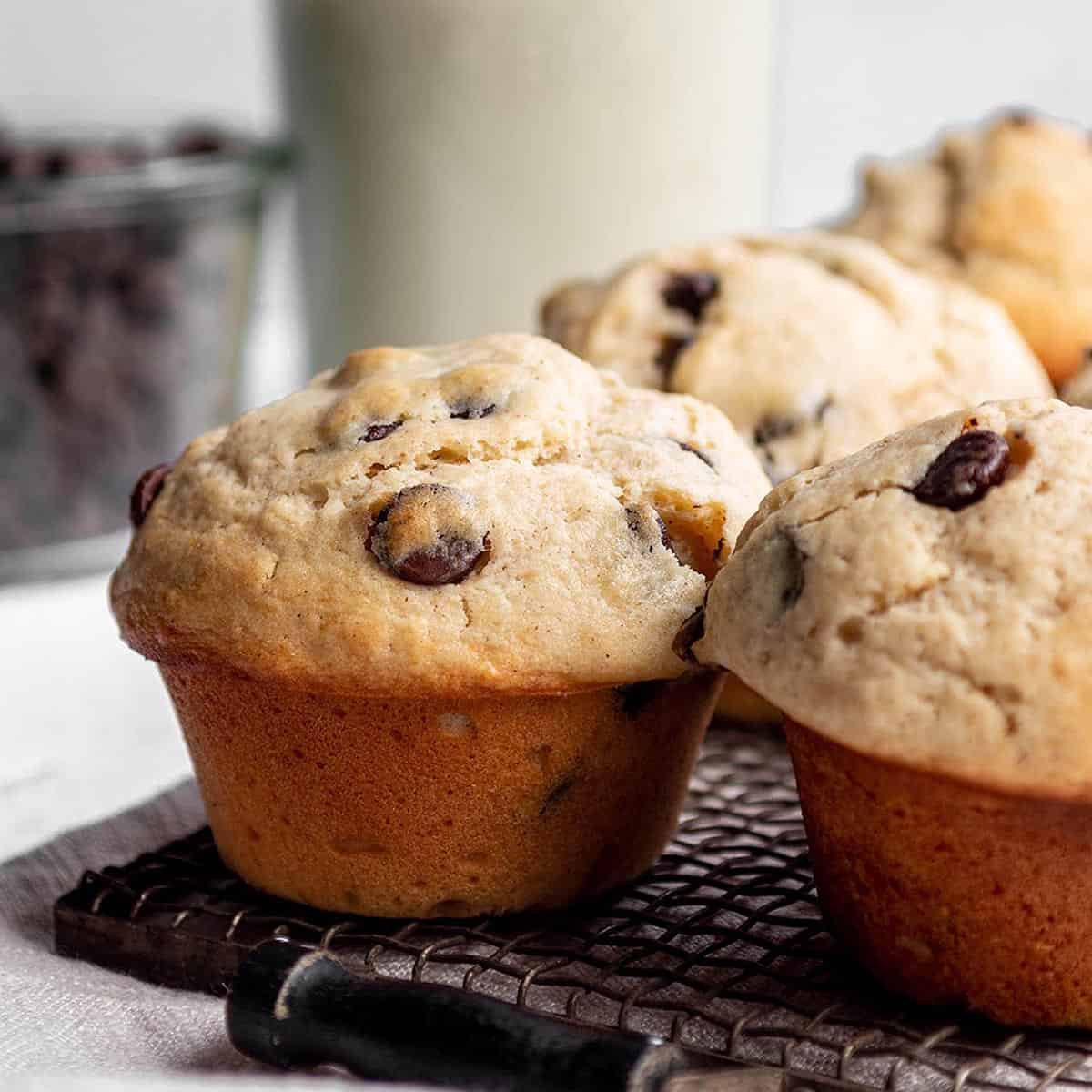 A vintage cooling rack with chocolate chip muffins.