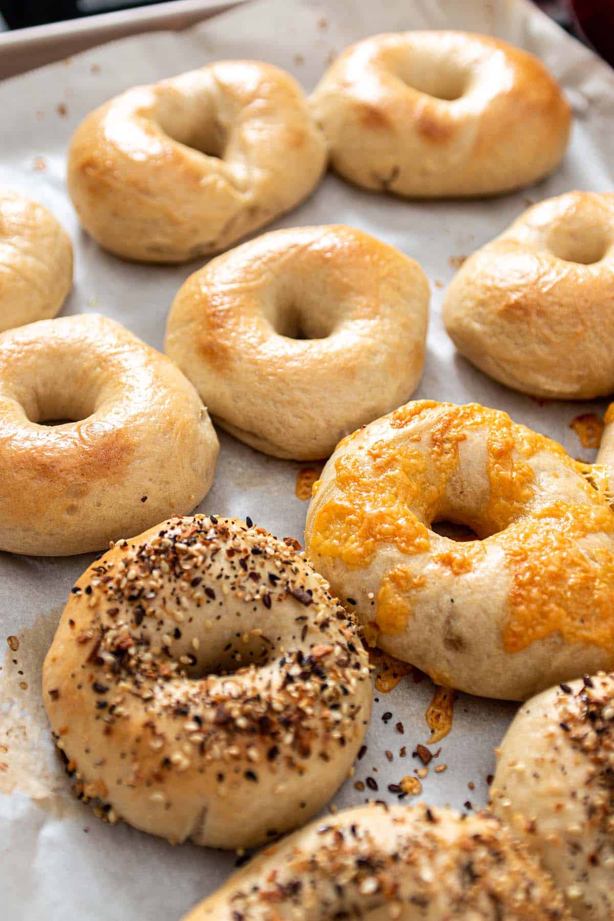 A baking sheet with bagels.