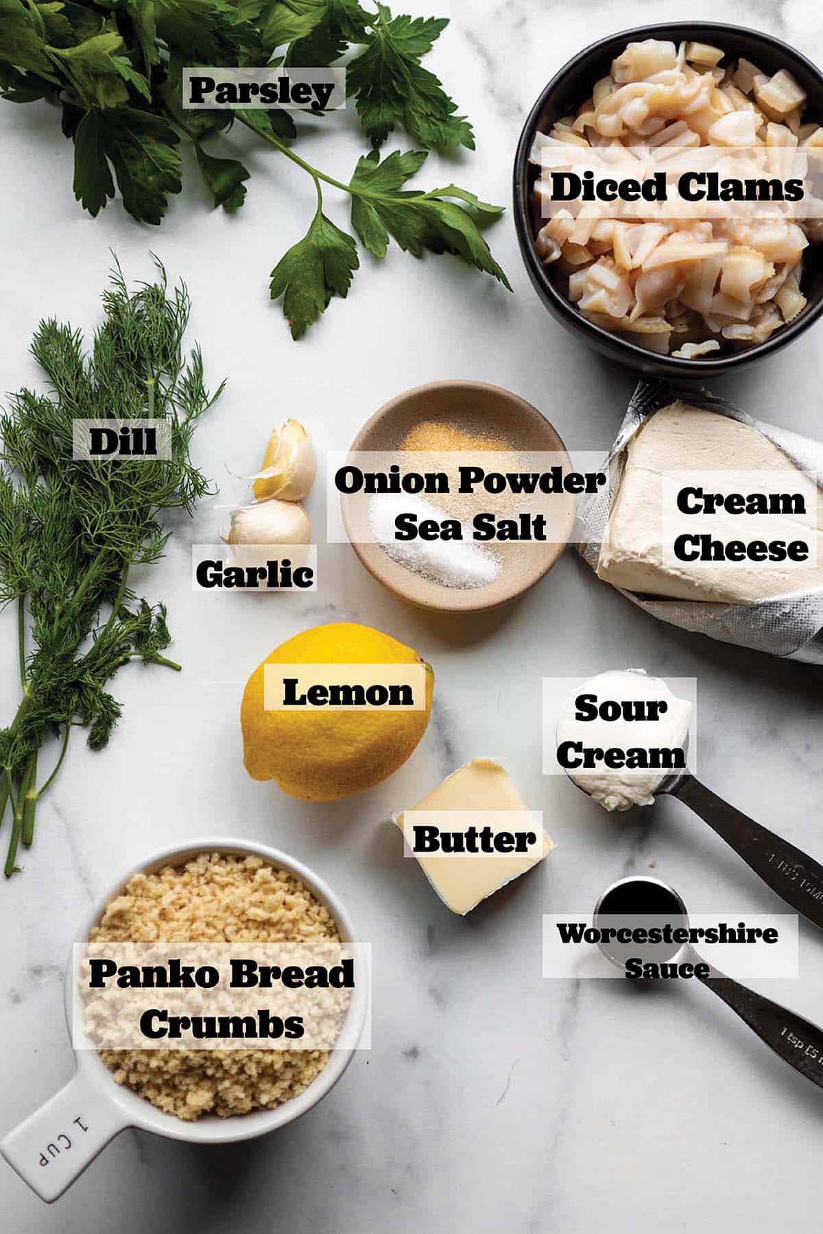 Ingredients laid out in prep bowls, fresh herbs, lemon, butter, and garlic.