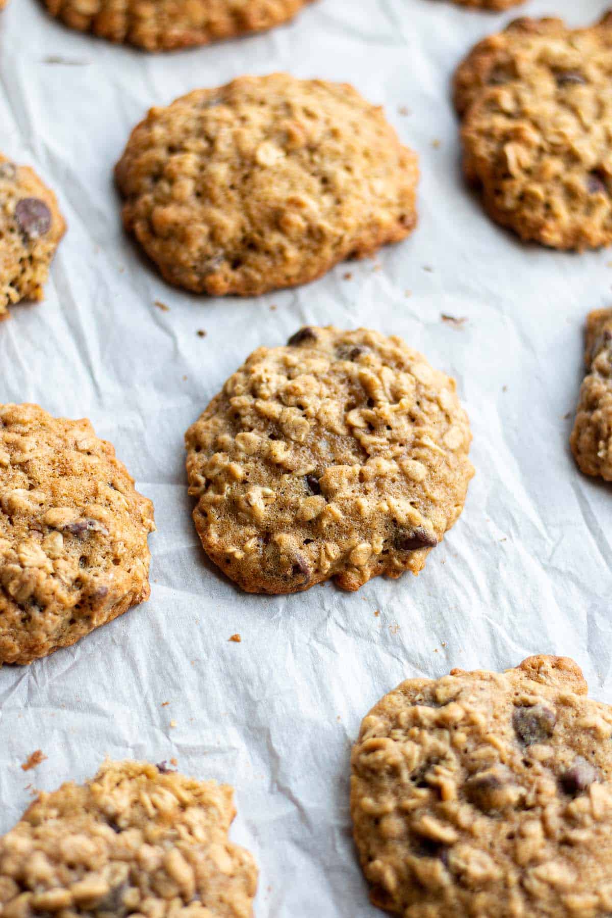 Baked oatmeal cookies on a baking sheet.