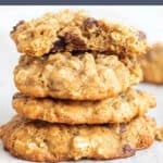 A stack of oatmeal cookies with text that says sourdough oatmeal cookies.