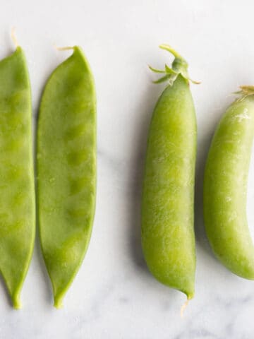Four peas, two sugar snap and two snow peas.