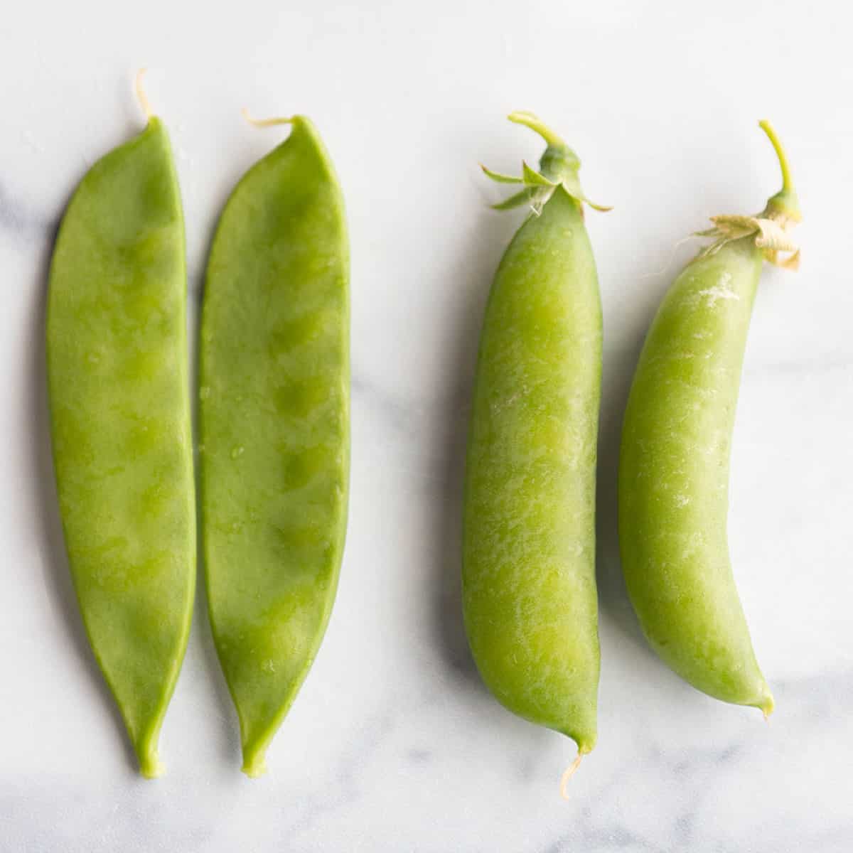 Four peas, two sugar snap and two snow peas.