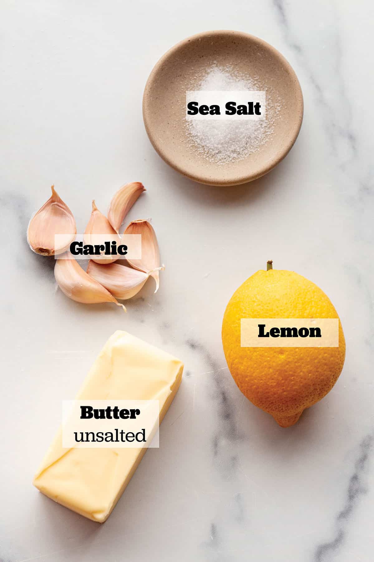 Stick of butter, fresh lemon, sea salt, and garlic cloves.