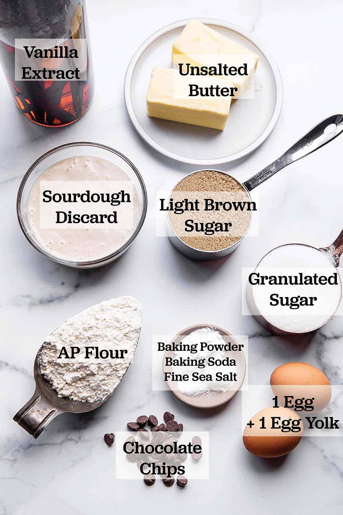 Ingredients in measuring cups and bowls to make a batch of cookies.
